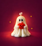 Vela Fantasma Halloween Moravi en cera marfil con mini calabaza roja